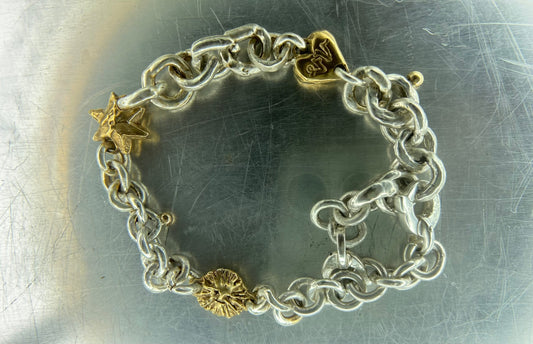 J's 14kt gold and .925 silver charm bracelet
